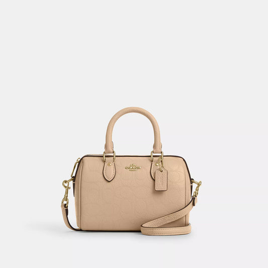 𝐂𝐎𝐀𝐂𝐇                       Mini bolso bandolera Rowan en piel de la firma CO009