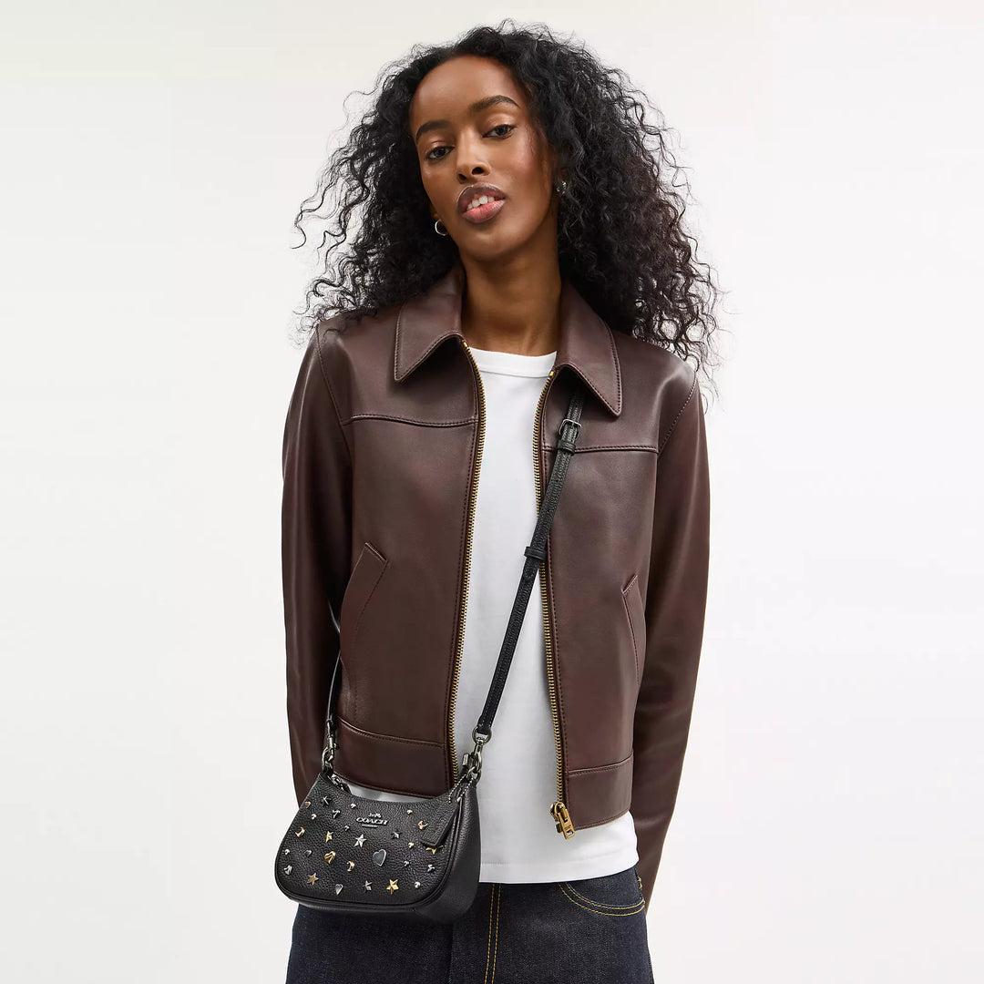 COACH | Teri Mini Crossbody Bag With Rivets | bolso negro con estoperoles con lunas y estrellas