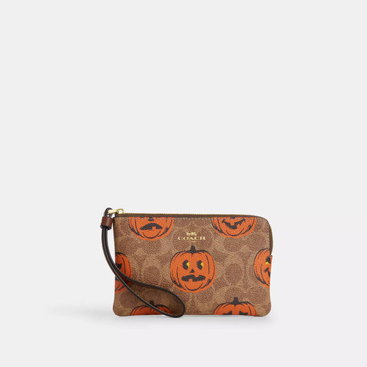 COACH |
Corner Zip Wristlet In Signature Canvas With Halloween Print | Cartera de Halloween