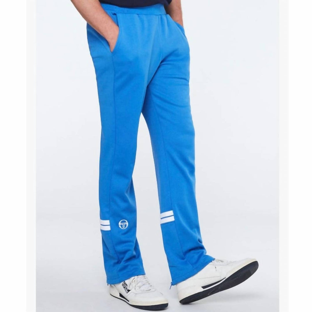 𝐒𝐄𝐑𝐆𝐈𝐎 𝐓𝐀𝐂𝐂𝐇𝐈𝐍𝐈 Pantalones deportivos Orion en azul palacio y blanco TAC50