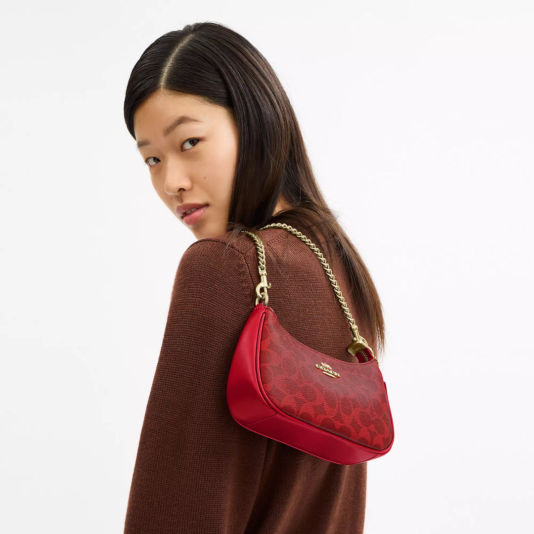 𝐂𝐎𝐀𝐂𝐇                     Bolso bandolera mini Teri en lona de la firma CO0023