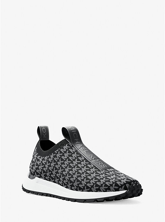 𝐌𝐈𝐂𝐇𝐀𝐄𝐋 𝐊𝐎𝐑𝐒 Zapatillas sin cordones de punto con logotipo metálico de Bodie MK0091