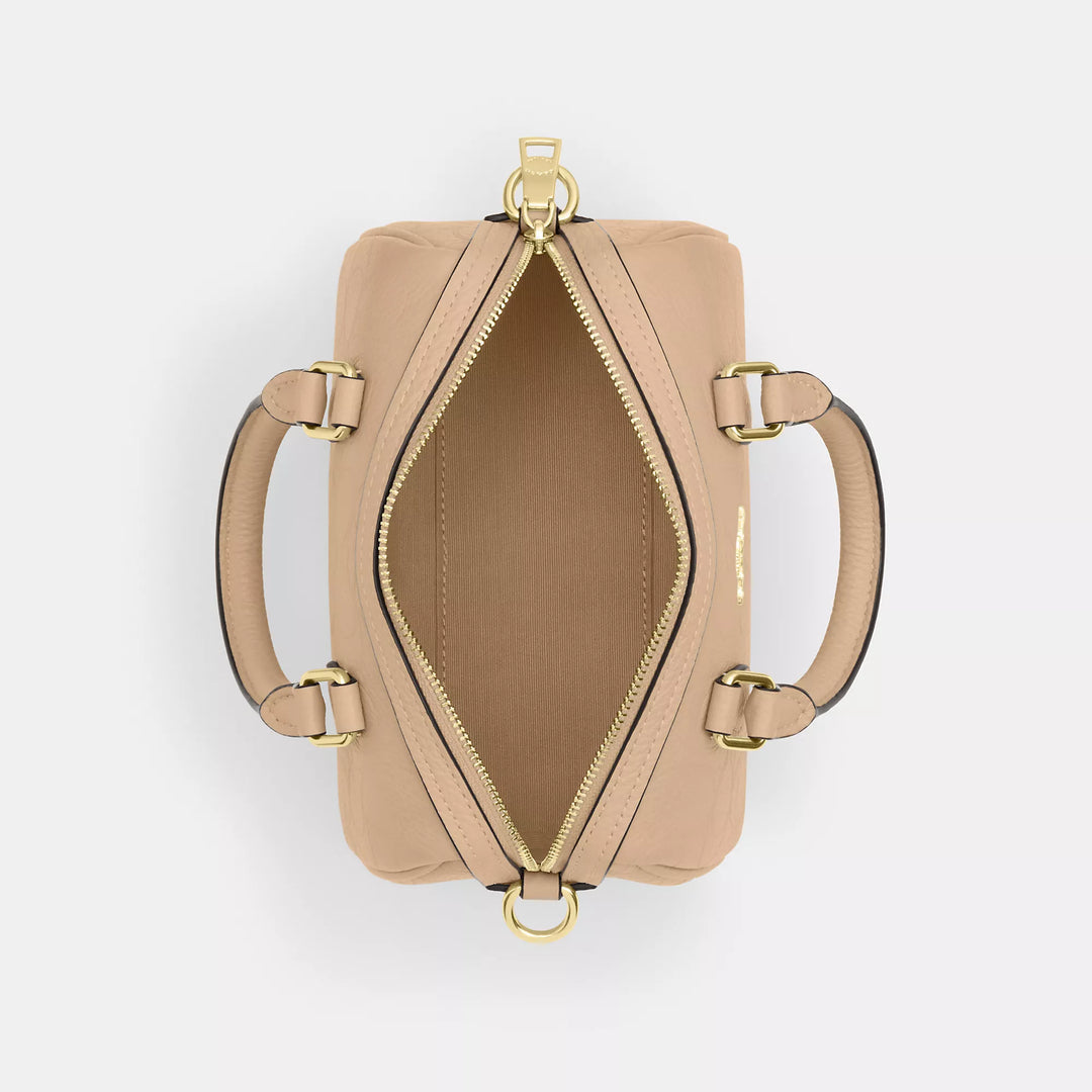 𝐂𝐎𝐀𝐂𝐇                       Mini bolso bandolera Rowan en piel de la firma CO009