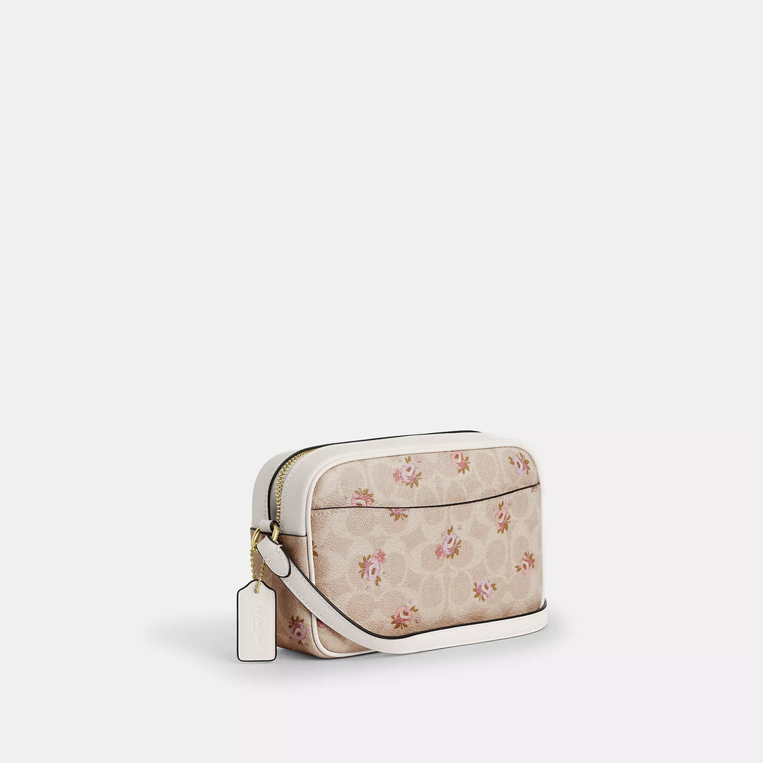 𝐂𝐎𝐀𝐂𝐇                     Bolso para cámara mini Jamie en lona de la firma con estampado floral. CO0025