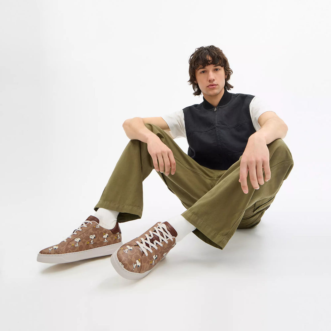 𝐂𝐎𝐀𝐂𝐇              Zapatillas deportivas Coach x Peanuts High Line en lona distintiva con estampado de Snoopy                 CO0017