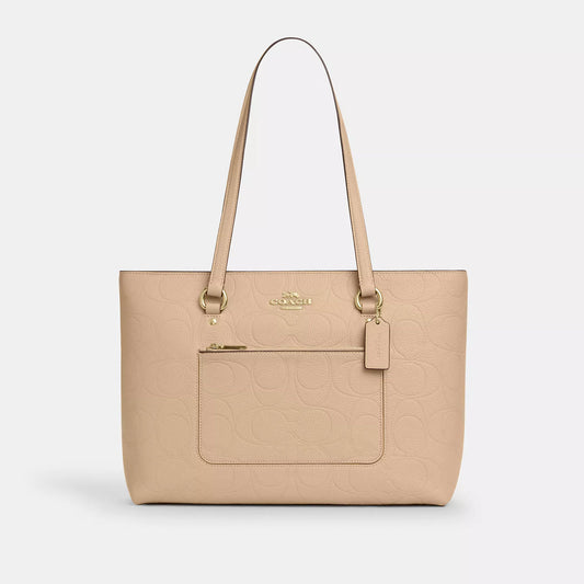 𝐂𝐎𝐀𝐂𝐇                     Bolso tote Station en piel de la firma            CO0013