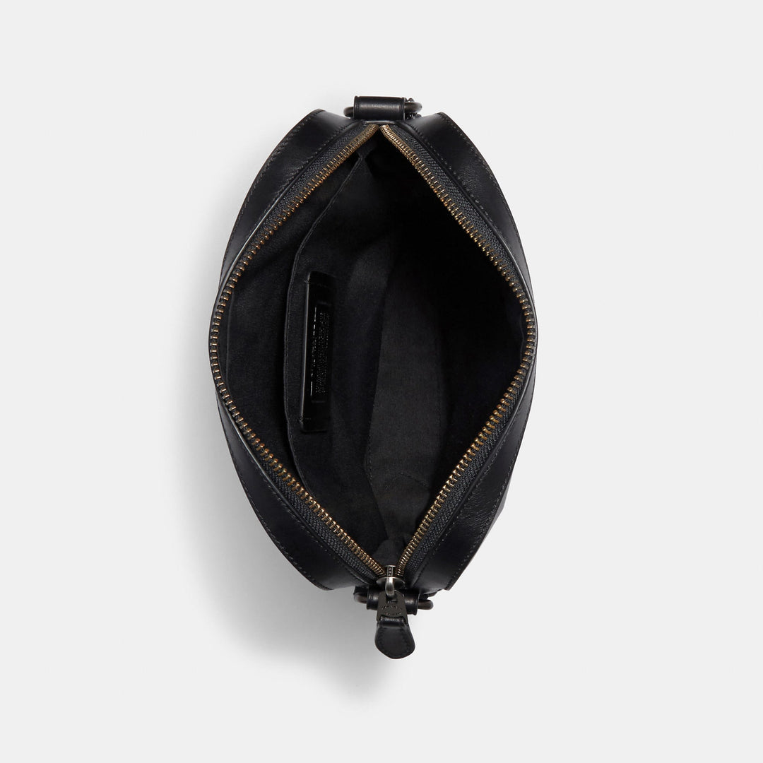 𝐂𝐎𝐀𝐂𝐇                     Bolso de vuelo Houston en piel de la firma CO0028