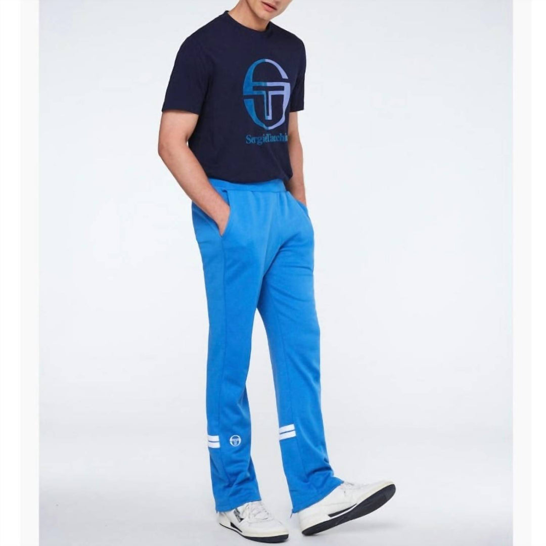 𝐒𝐄𝐑𝐆𝐈𝐎 𝐓𝐀𝐂𝐂𝐇𝐈𝐍𝐈 Pantalones deportivos Orion en azul palacio y blanco TAC50