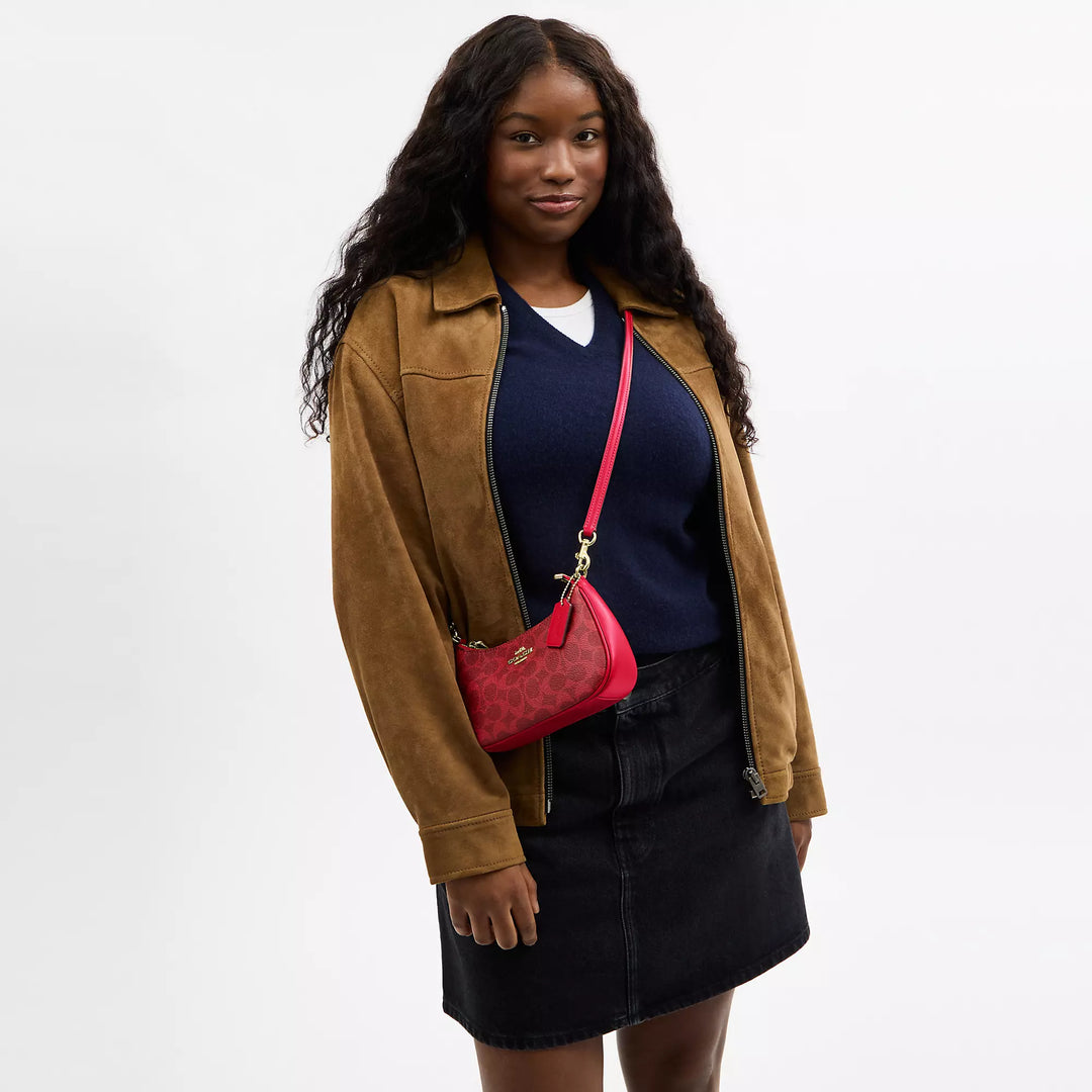 𝐂𝐎𝐀𝐂𝐇                     Bolso bandolera mini Teri en lona de la firma CO0023