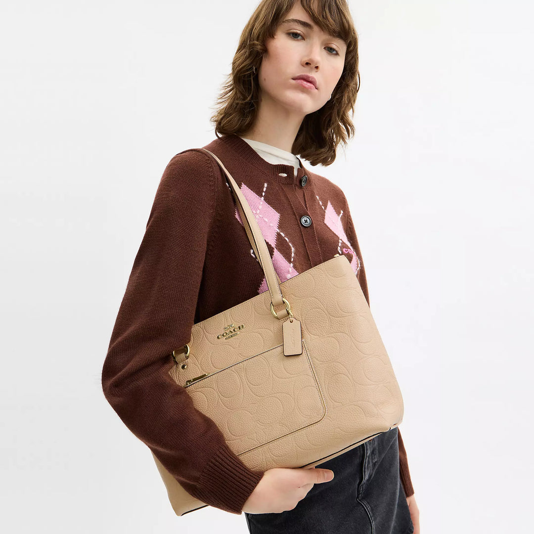 𝐂𝐎𝐀𝐂𝐇                     Bolso tote Station en piel de la firma            CO0013