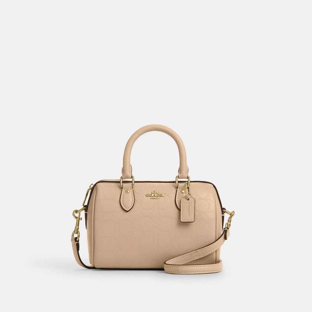 𝐂𝐎𝐀𝐂𝐇                       Mini bolso bandolera Rowan en piel de la firma CO009