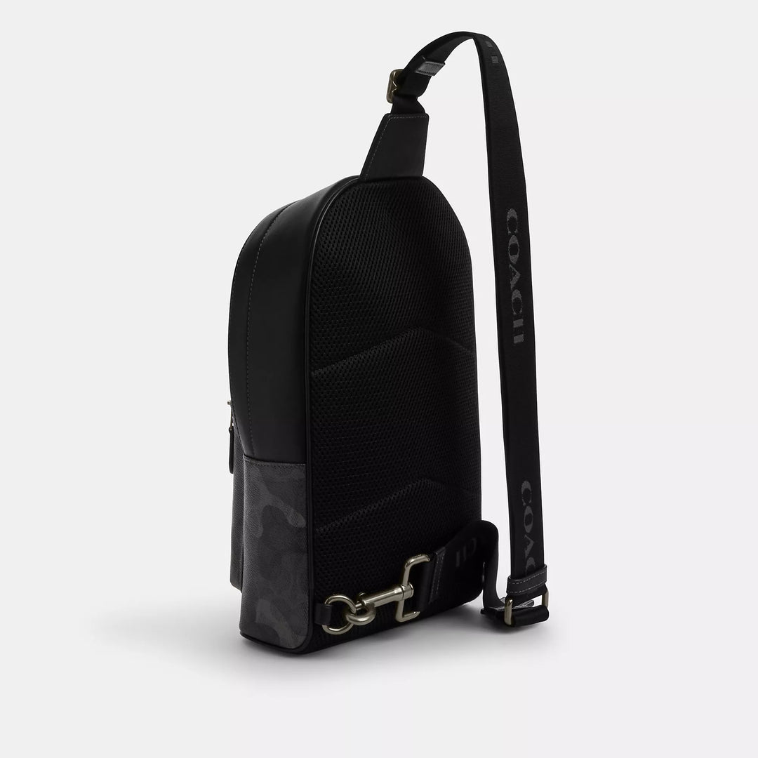 𝐂𝐎𝐀𝐂𝐇                 Mochila West con el característico estampado de camuflaje        CO0034