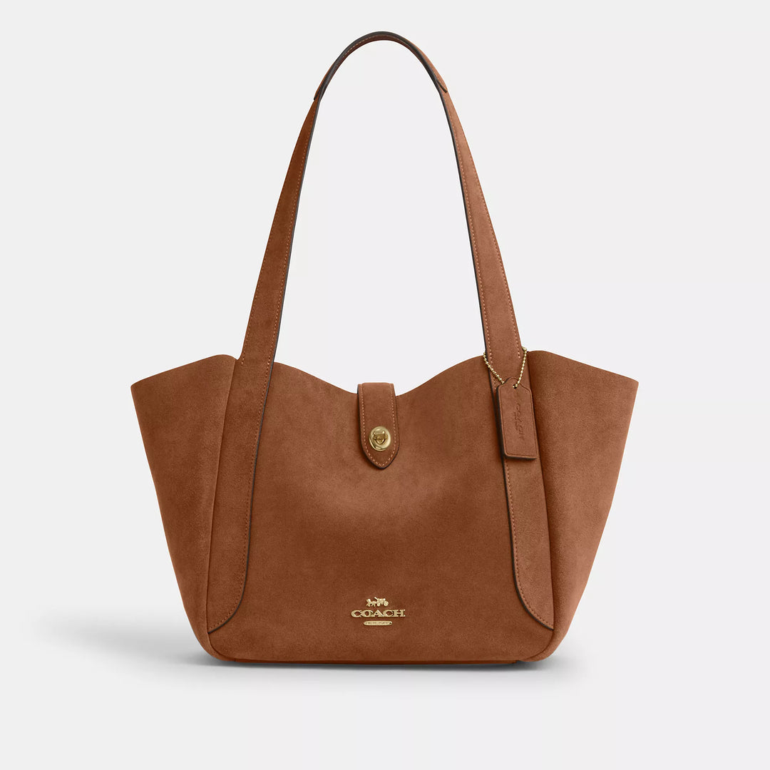 𝐂𝐎𝐀𝐂𝐇                     Bolso de mano Hadley con cierre giratorio CO003