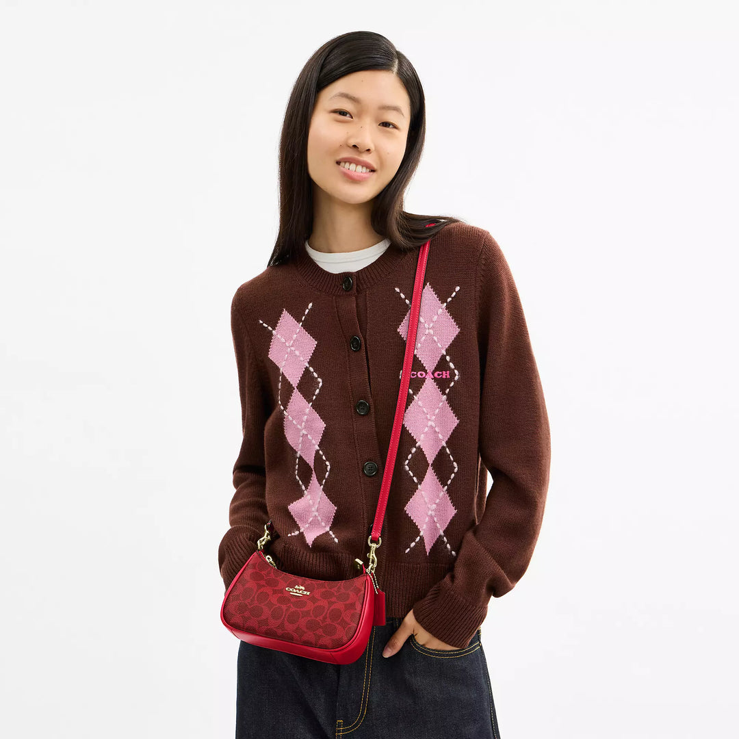 𝐂𝐎𝐀𝐂𝐇                     Bolso bandolera mini Teri en lona de la firma CO0023